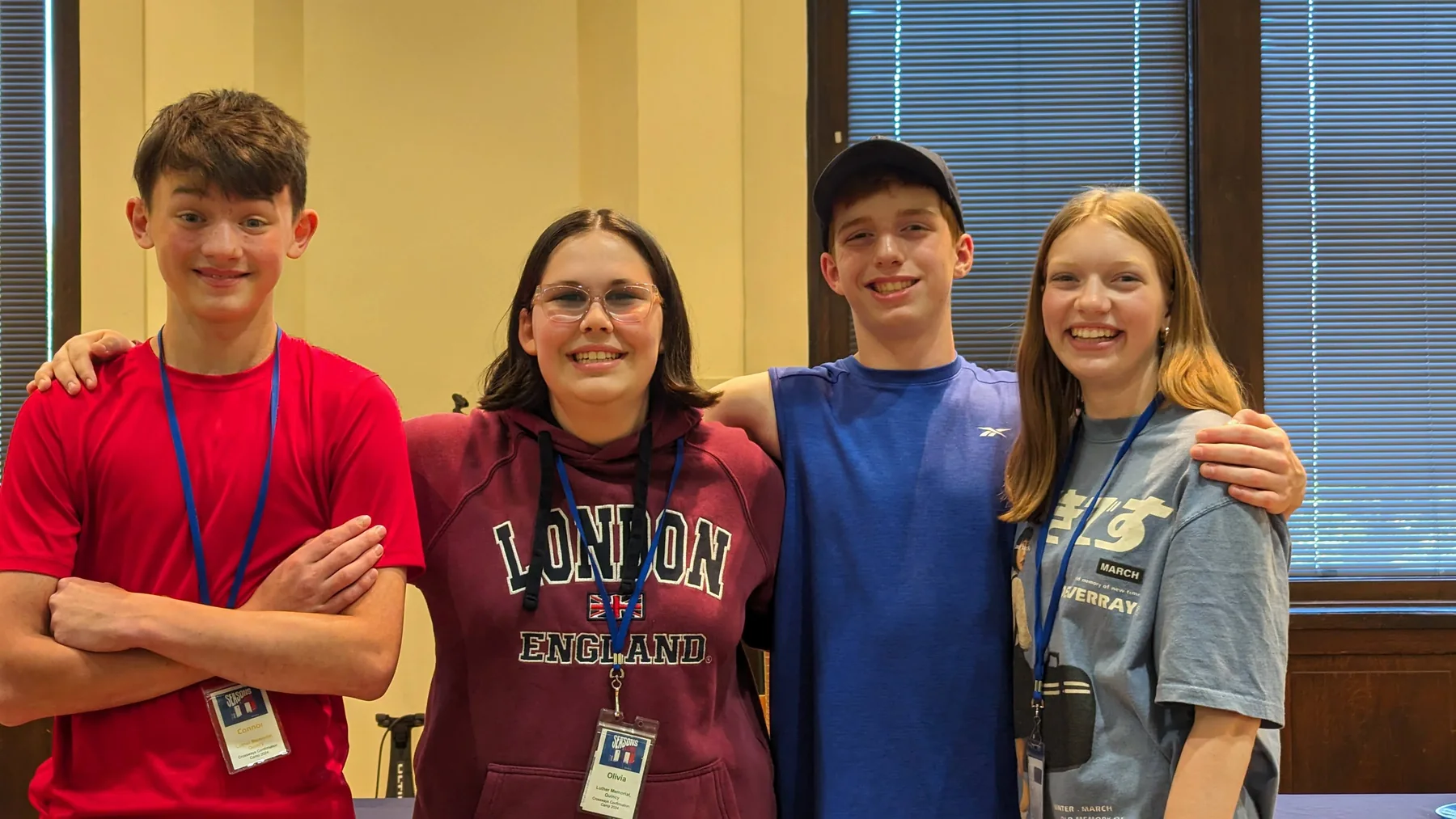 Campers posing together indoors